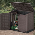 Duramax StoreAway 1200L Brown outdoor storage shed with tools and garden equipment in a garden setting