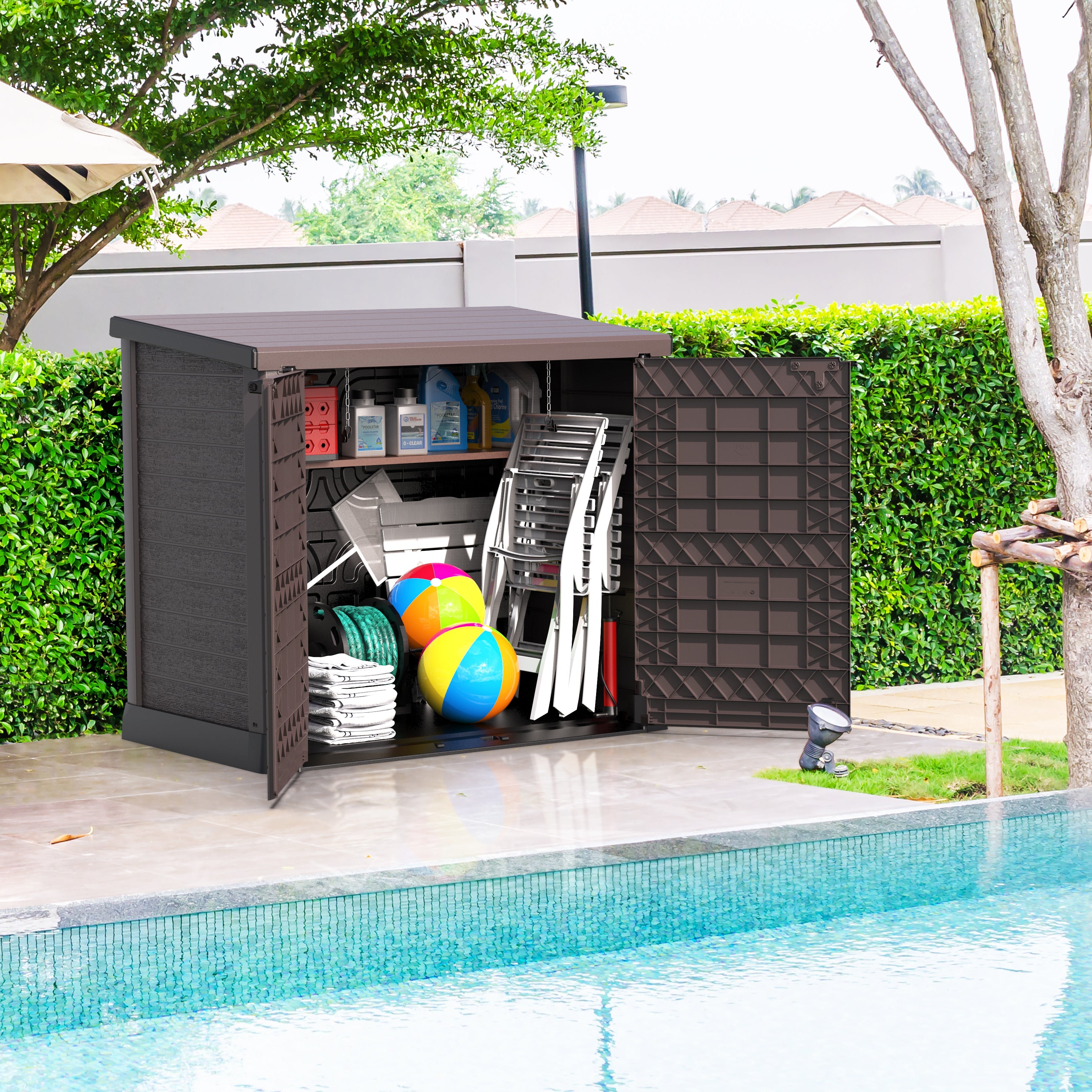 Duramax StoreAway 1200L Outdoor storage shed by a pool with pool supplies inside