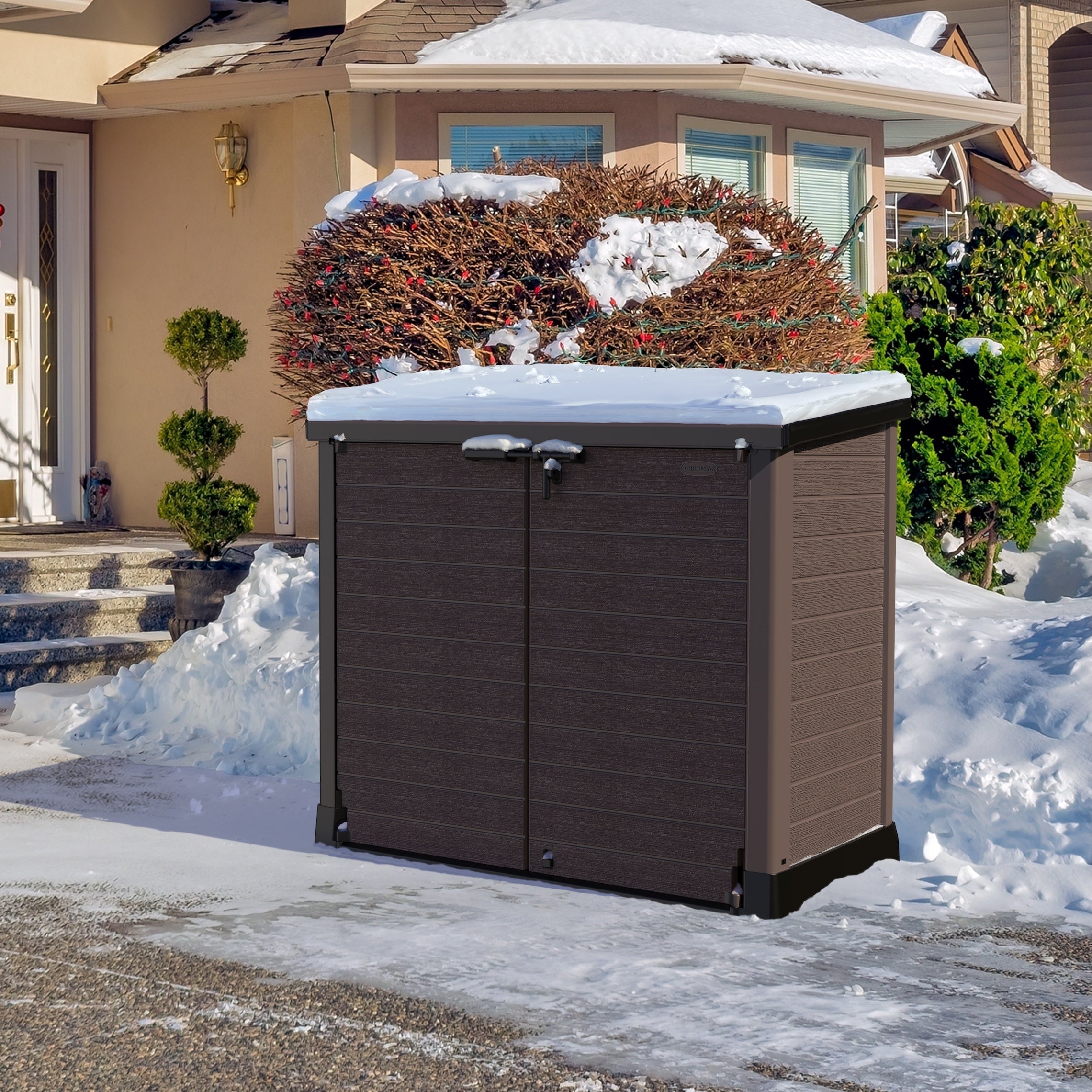 Duramax StoreAway 1200L Outdoor storage shed in front of a house with snow on the ground