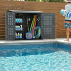 Duramax StoreAway 1200L in front of a pool with accessories