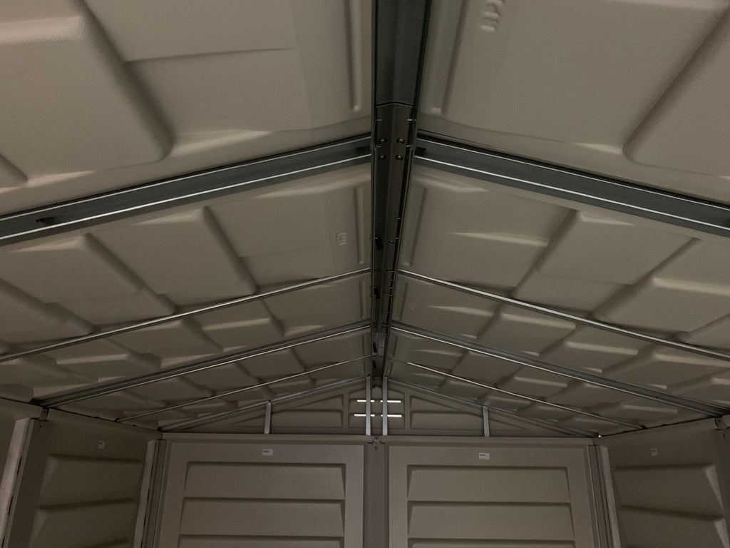Plastic shed with strong metal structure roof.