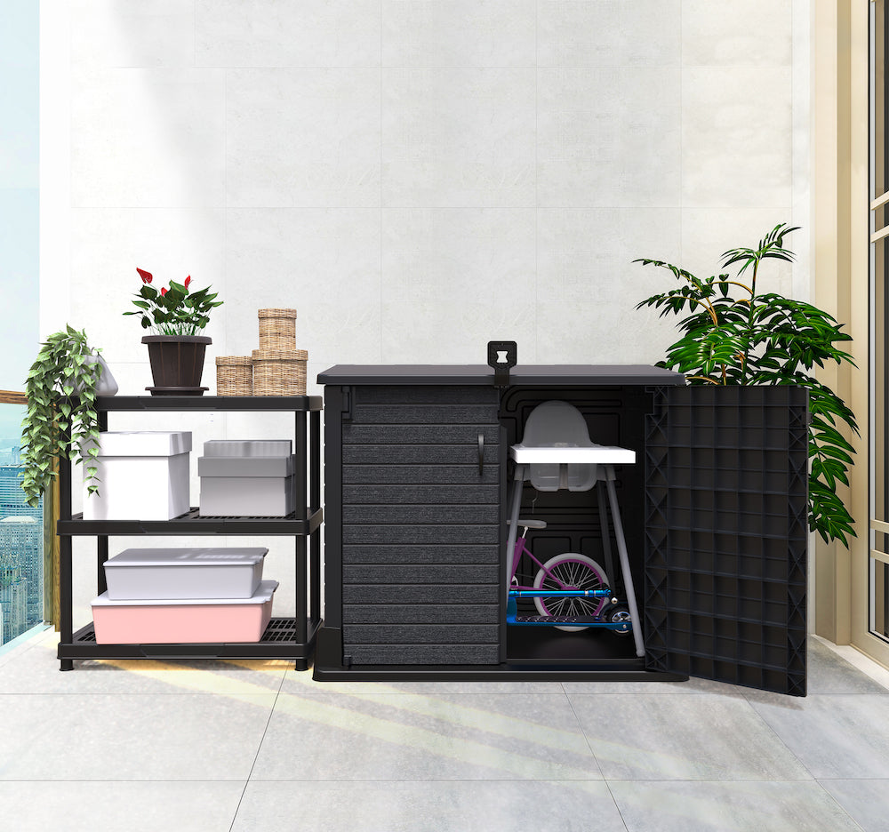 Dark grey plastic storage shed for indoor uses, ideal for storing toys, seats and equipment.