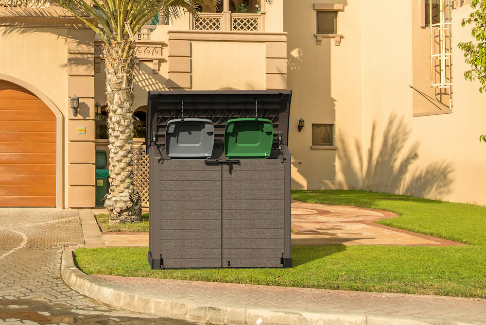 Brown storage shed with top opening for trash containers.